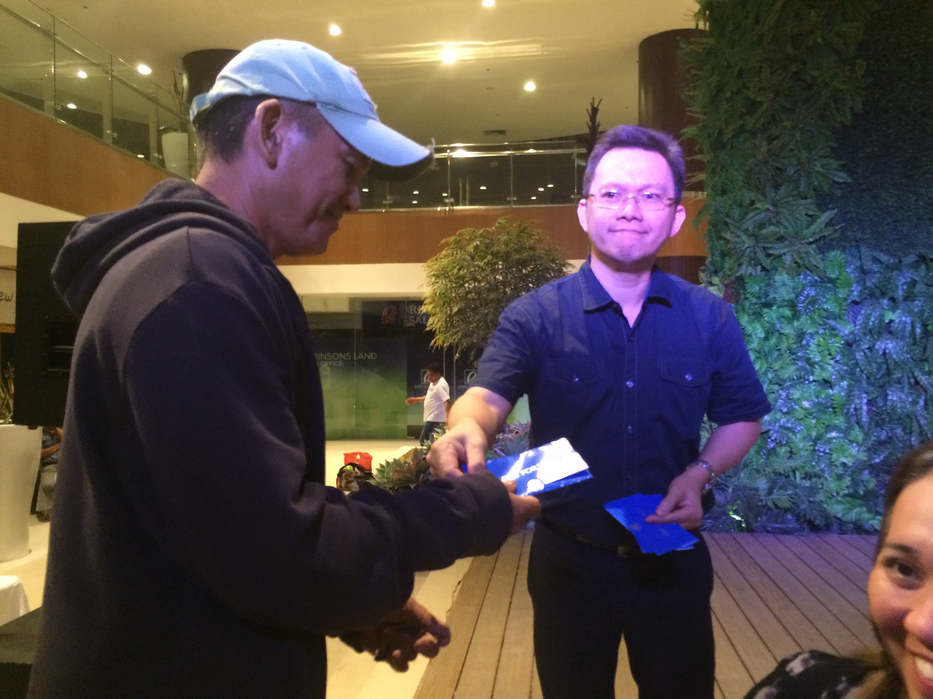 Partner Wendell Gahinhin awarding winner of SM Gift Certificates